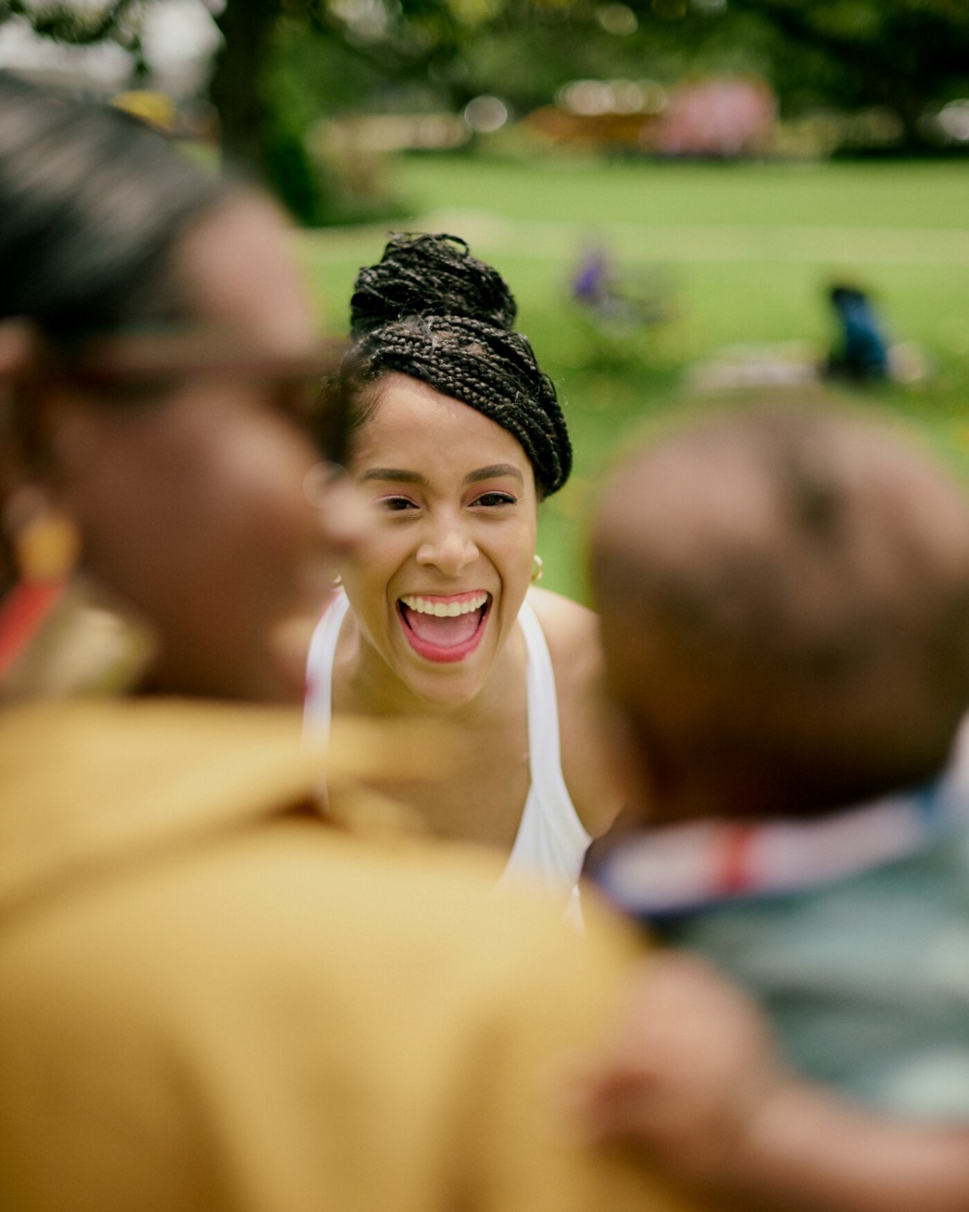Janitza Vasquez, founder of One Happy Mama, laughing with families at the Black Maternal Health Week Block Party