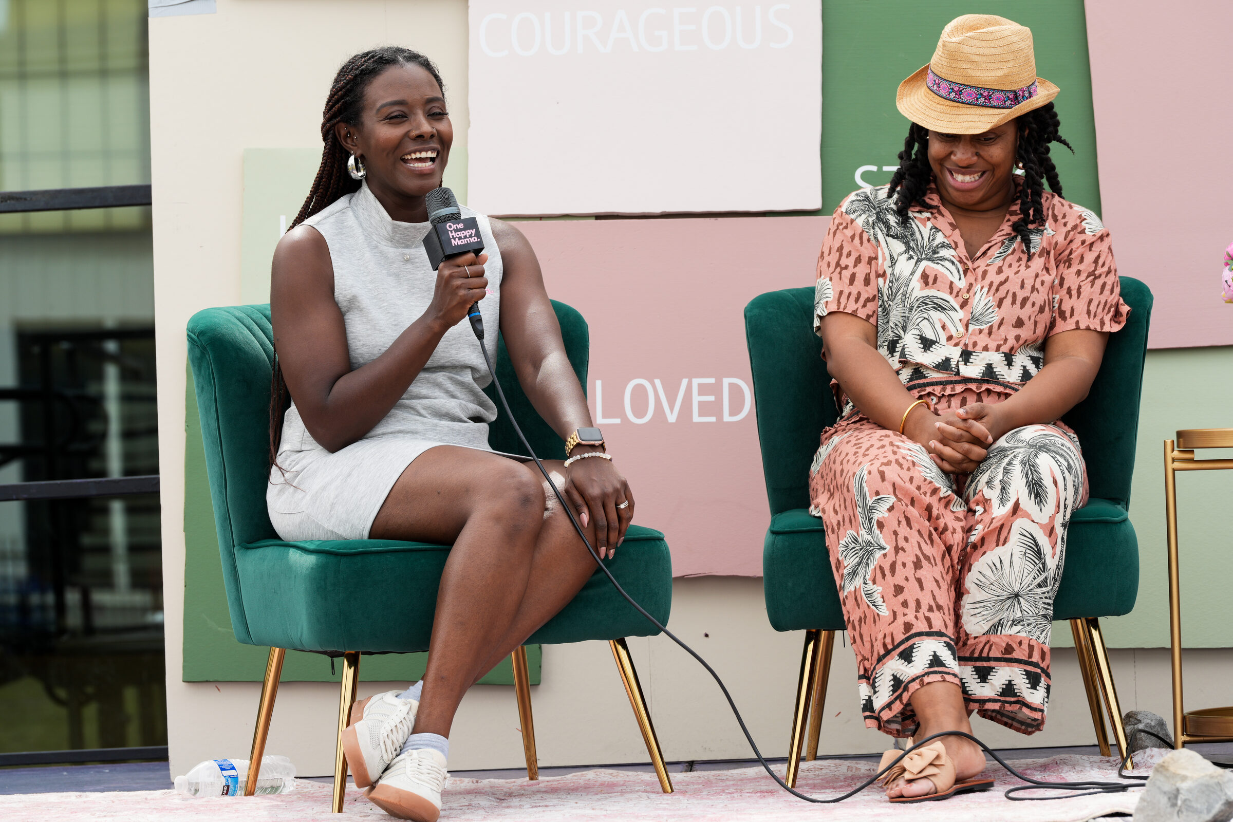 A panel conversation on stage at the Rooted in Love Block Party